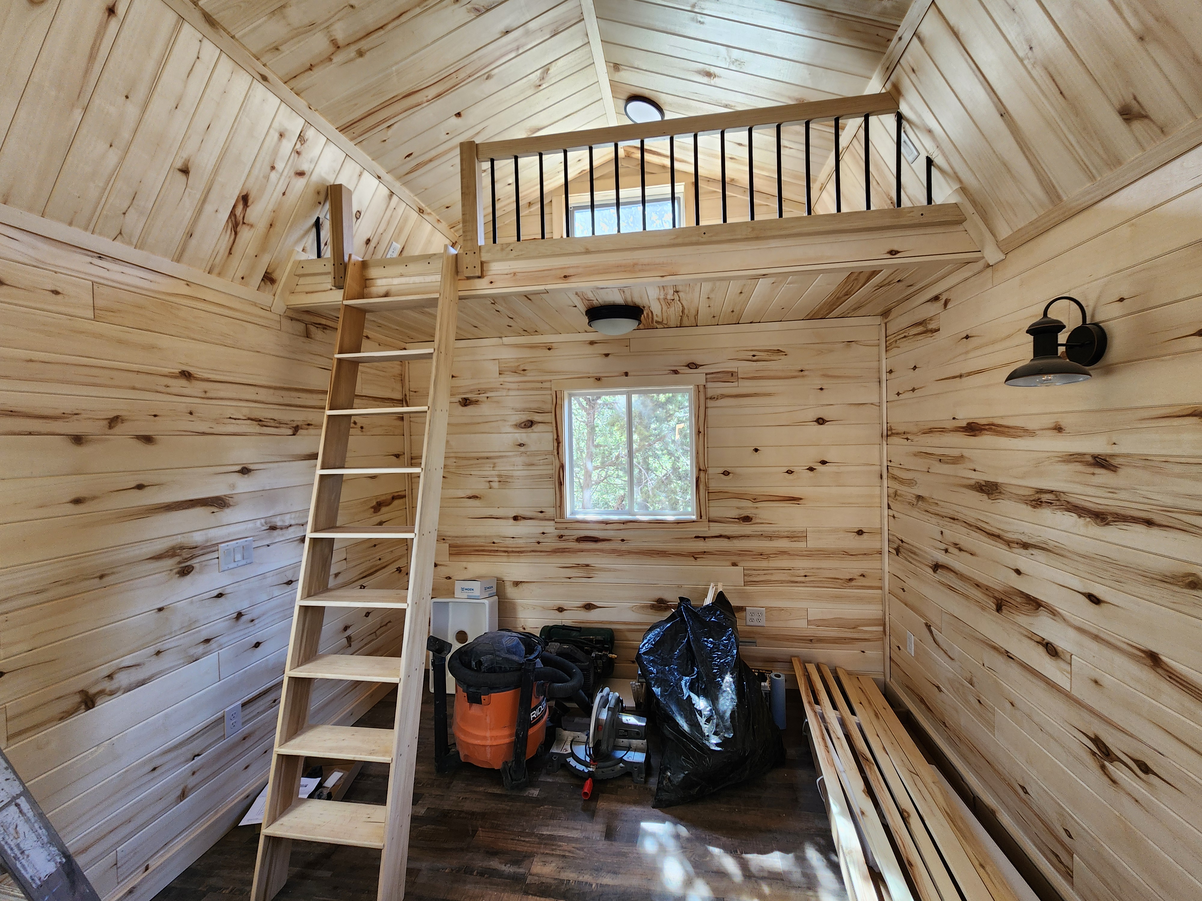 Interior of Peach Cabin with bedroom and loft - family-friendly vacation cabin